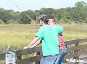 father and son fishing together