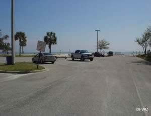 Vehicle with trailer parking at sanders beach ramp