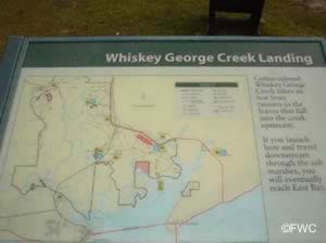 informational sign at whiskey creek landing eastpoint florida