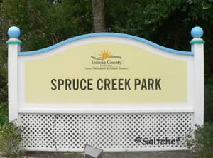 sign at entrance to spruce creek park